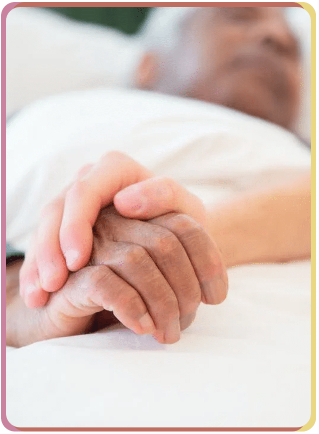 holding elderly hand in hospital