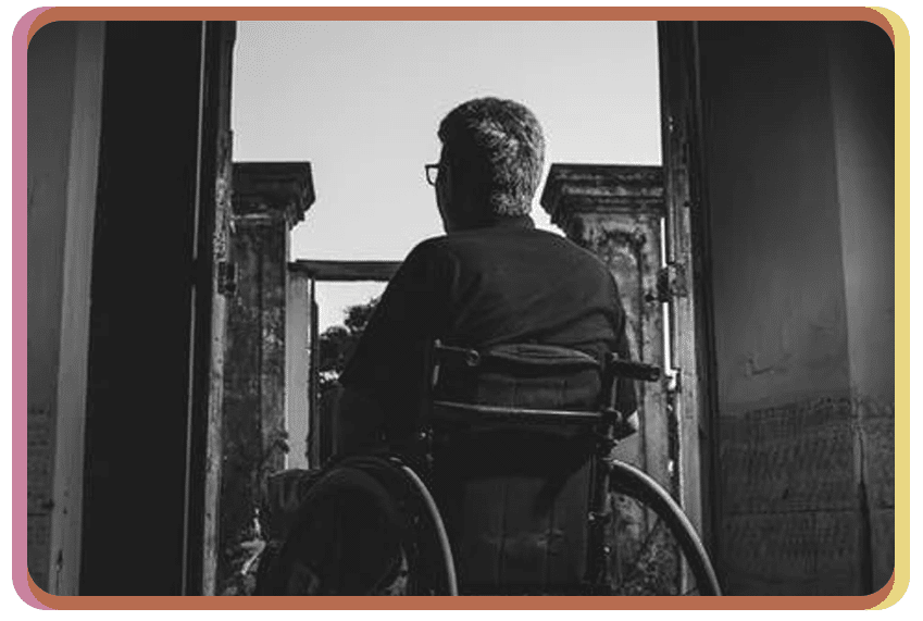 b&w photo of man in wheelchair