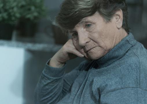 An elderly woman that is depressed