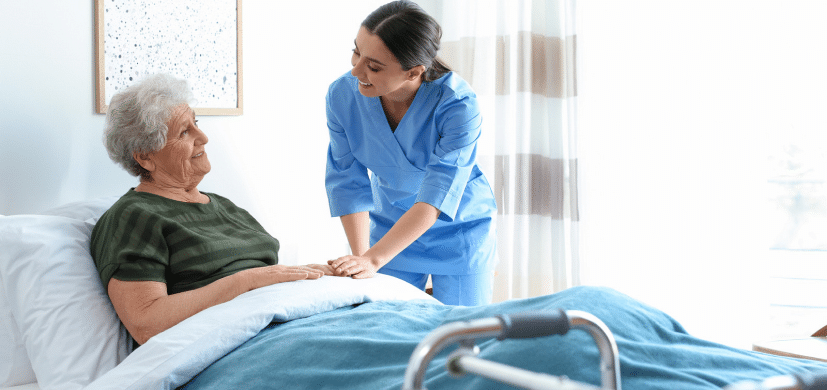 A nurse and an elderly woman with stage one bedsore