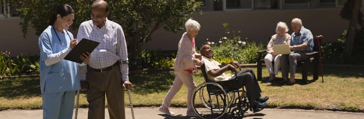 elders in Cheltenham nursing home and a female doctor outside